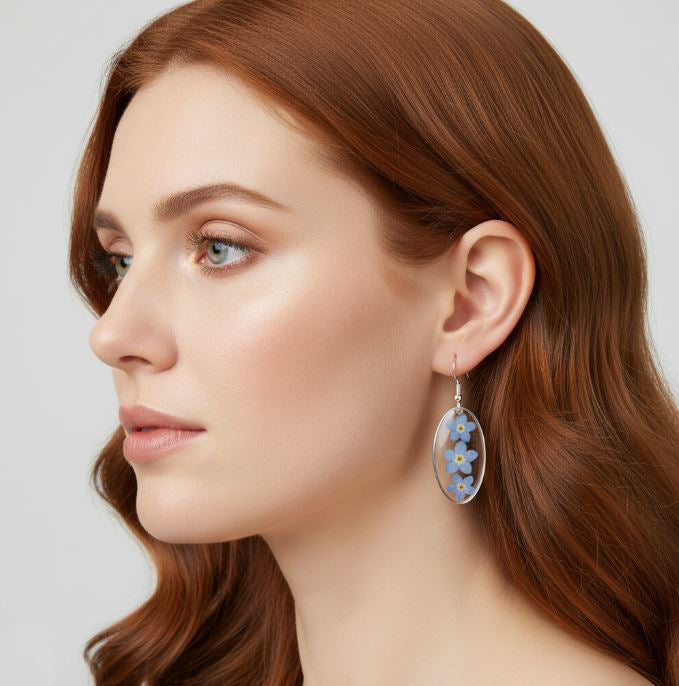 Woman wearing floral earrings with a neutral background