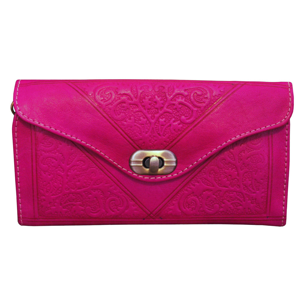 Handcrafted Moroccan tri-fold leather purse with embossed detailing and multiple compartments for cards and coins