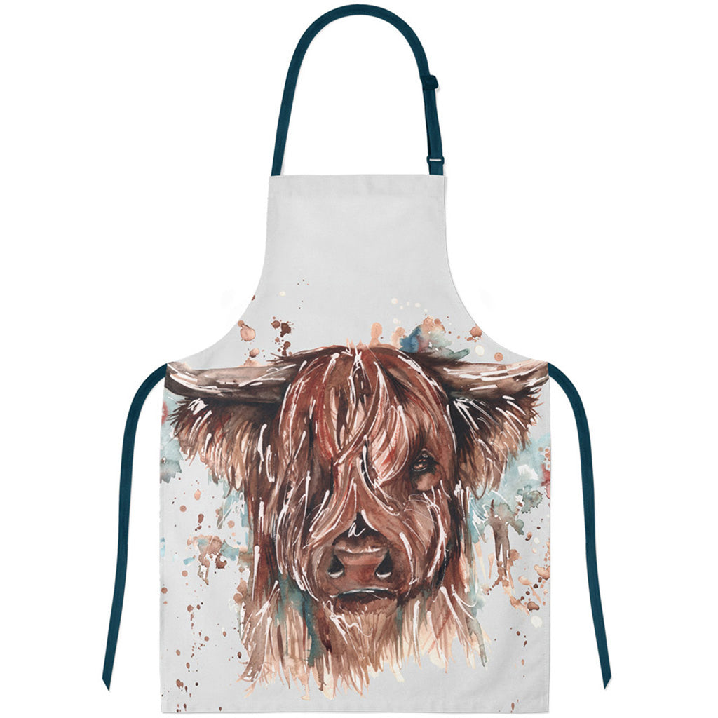Cooking apron with a Meg Hawkins highland cow design on a white background
