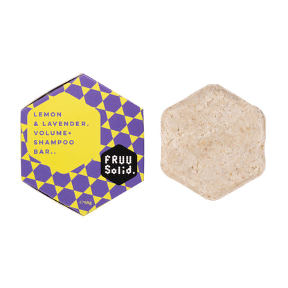 Fruu Lemon and Lavender Volume+ Shampoo Bar 55g in purple and yellow honeycomb packaging next to the natural solid shampoo bar.