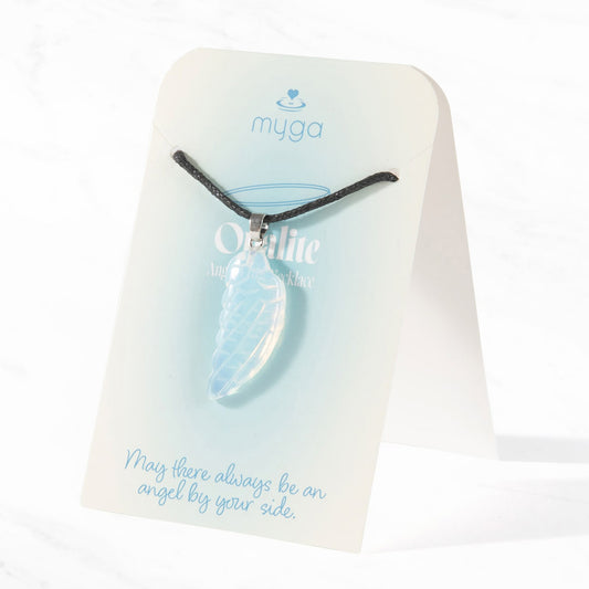 Luminous iridescent Opalite angel wing pendant on an adjustable black cord, showing milky blue and golden hues, presented on a blue and white Myga display card with the text "May there always be an angel by your side."