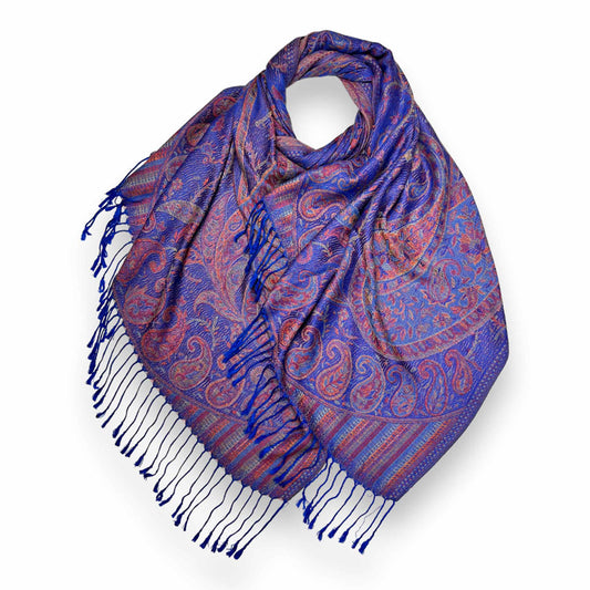 A vibrant royal blue and multi-tonal jacquard paisley pashmina scarf made from a 50% cotton and 50% viscose blend, draped to show the intricate reversible pattern and classic tassel ends.
