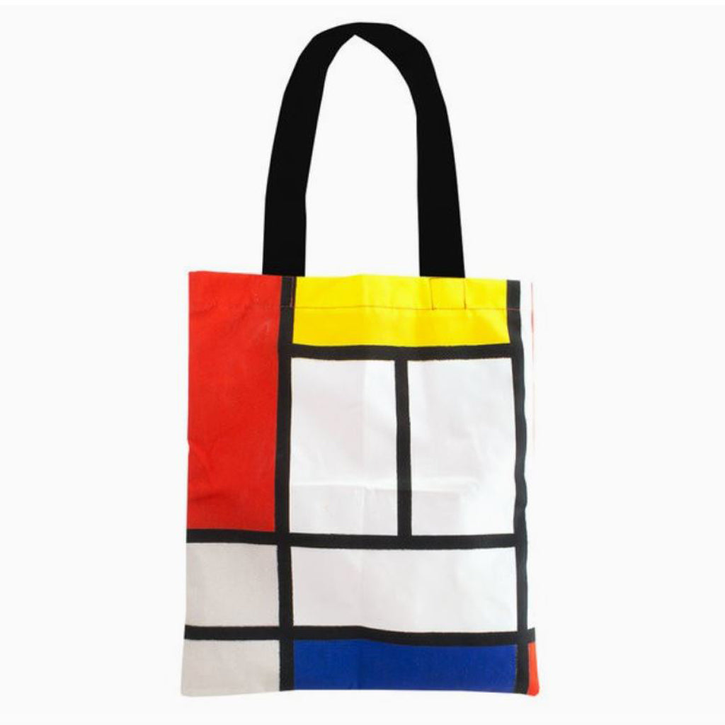 Mondrian abstract art sturdy cotton tote bag in iconic red, blue, and yellow geometric print.