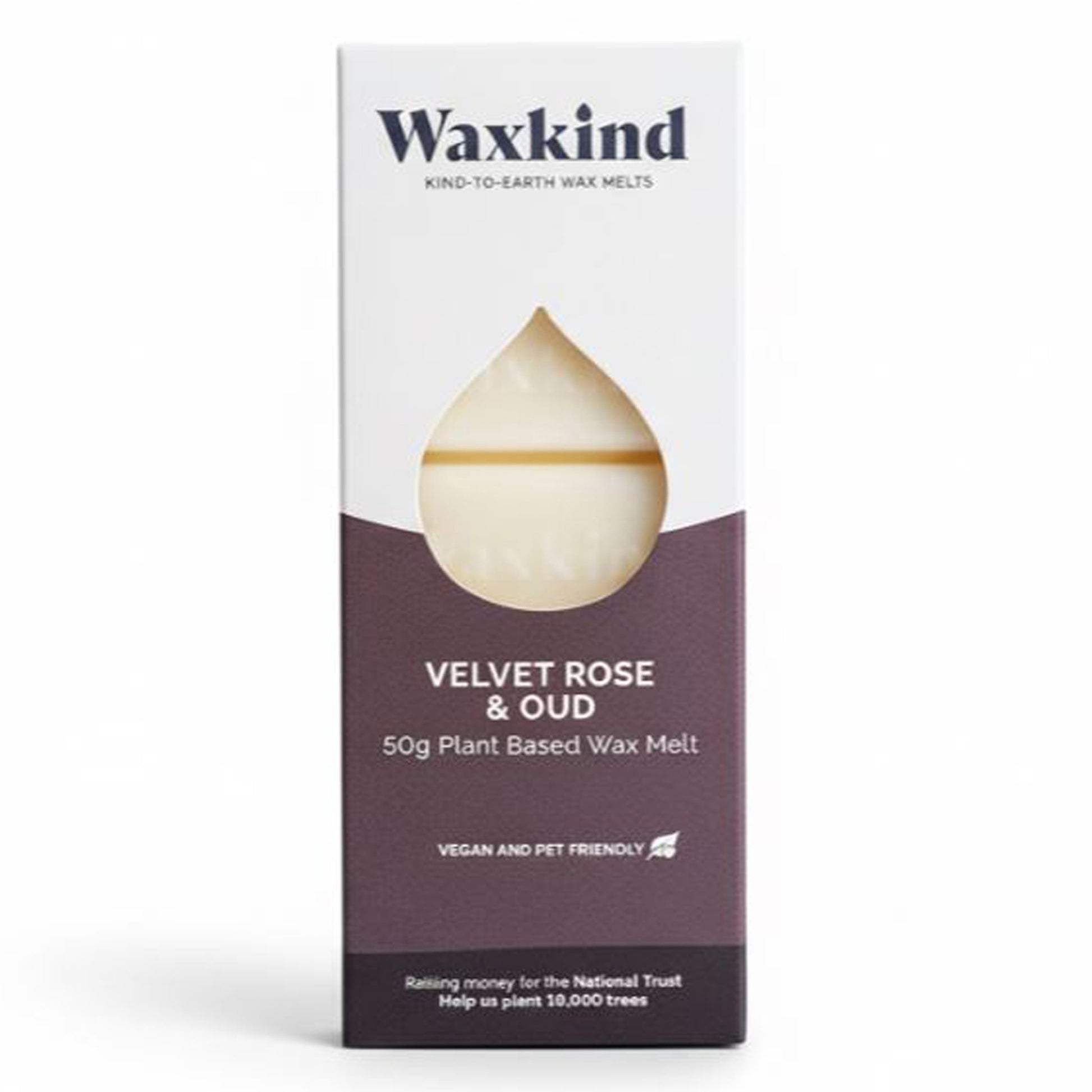 Close-up of the Velvet Rose & Oud Waxkind packaging. White top with navy logo, dark mauve bottom section. A clear teardrop window reveals the cream-coloured wax bar inside. Text confirms 50g weight and vegan-friendly status.
